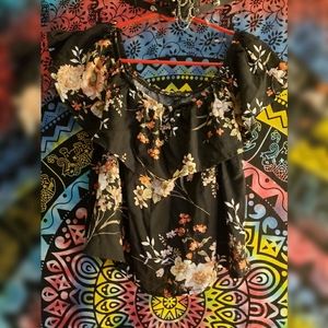 Black flower print ruffle off shoulder top.
